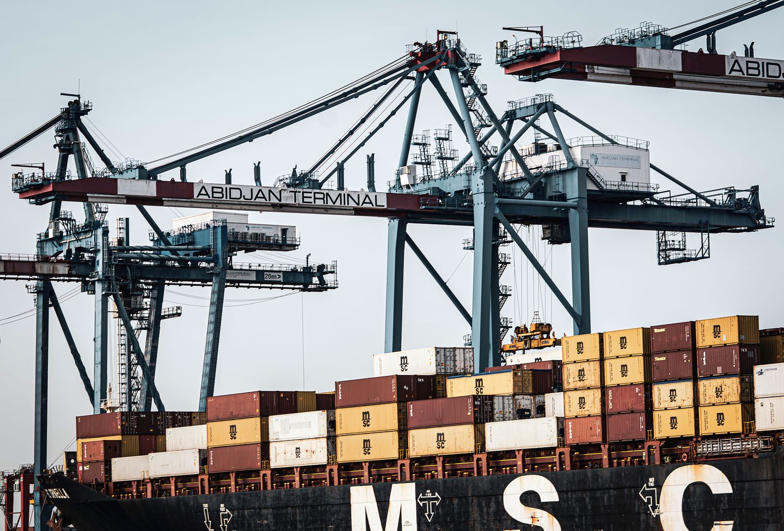Container cranes and cargo containers at Abidjan Terminal, a West African port